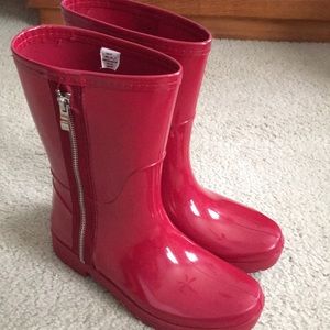 Red zipper rain boots